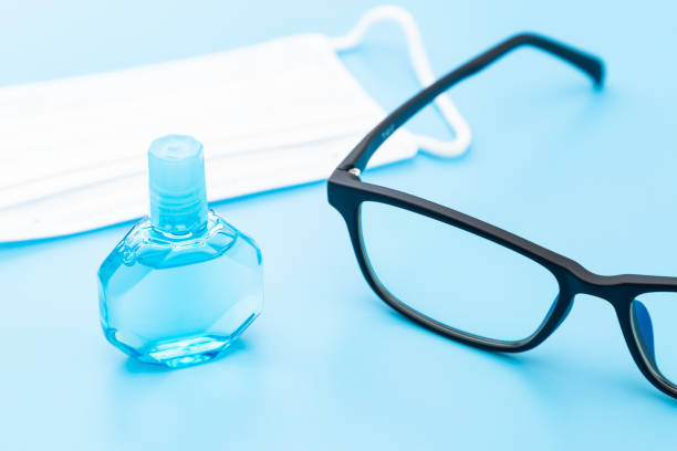 istock Eye drops, glasses and mask on blue background. 1658301197