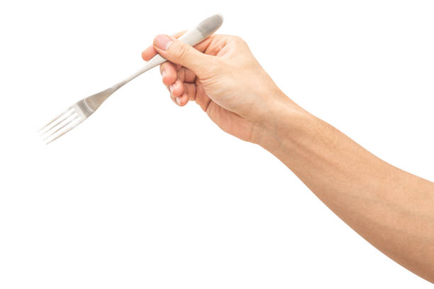 istock isolated of a man's hand holding a silver steel fork. 1658304244