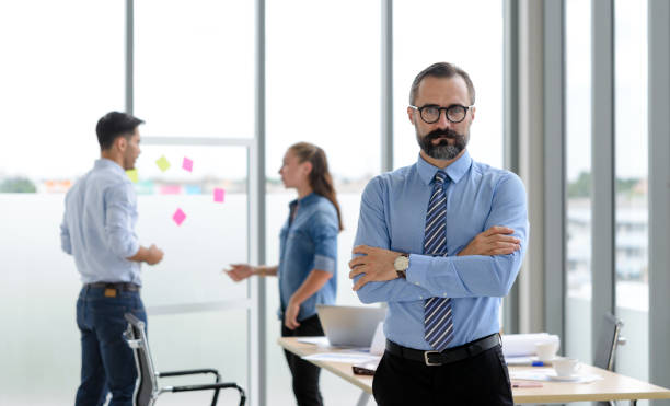 istock construction engineer manager standing in front of engineers team meeting for architectural project in the office construction site. 1658304595