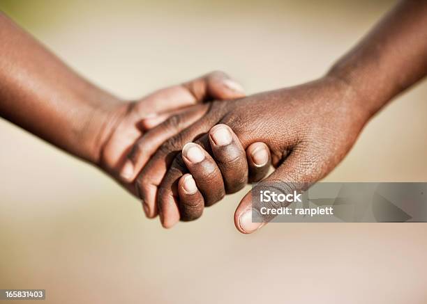 Two African Children Holding Hands Stock Photo - Download Image Now - Holding Hands, Africa, Tanzania