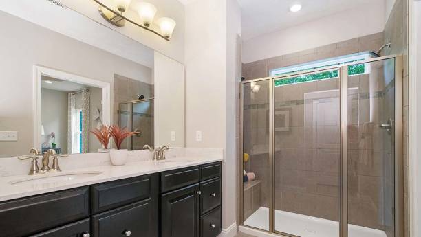 istock Dark wood cabinets in perfect bathroom 1658329019