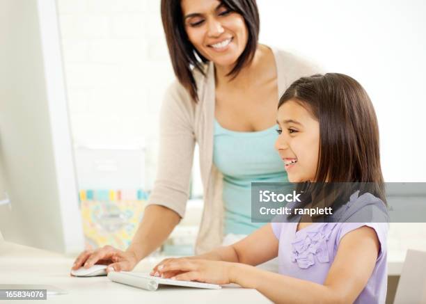 Mother And Daughter Using A Computer Stock Photo - Download Image Now ...