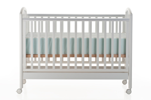 White baby crib on white background