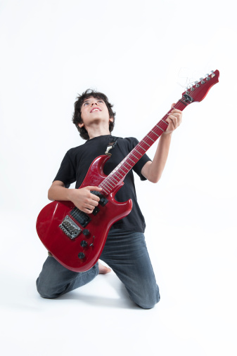 Young Guitar Player on White Background 