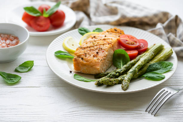 istock Baked Delicious salmon, green asparagus on  plate 1658377587