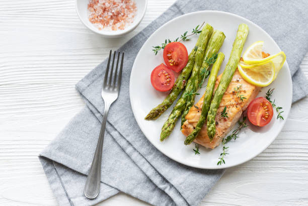 istock Baked Delicious salmon, green asparagus on  plate 1658377588
