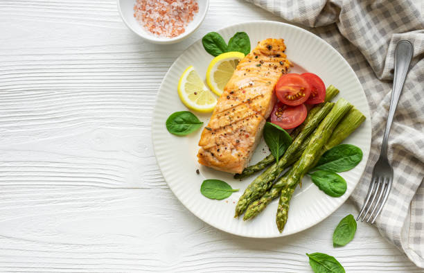 istock Baked Delicious salmon, green asparagus on  plate 1658377589