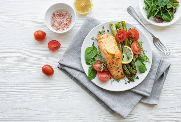 istock Baked Delicious salmon, green asparagus on  plate 1658377593