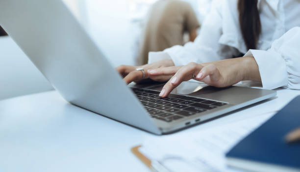 istock young woman using laptop on desk 1658407999