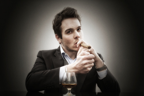 Jacket weared young man with cigar and drink.\u2028http://www.massimomerlini.it/is/lifestyles.jpg
