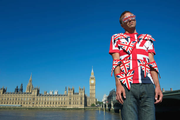 istock Man Wrapped in Union Jack Flag Bunting London Overwhelmed 165843586