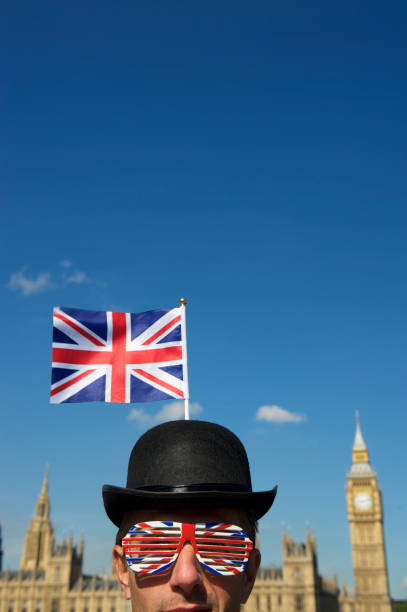istock Union Jack Bowler Hat Man Stands at Westminster London 165843710
