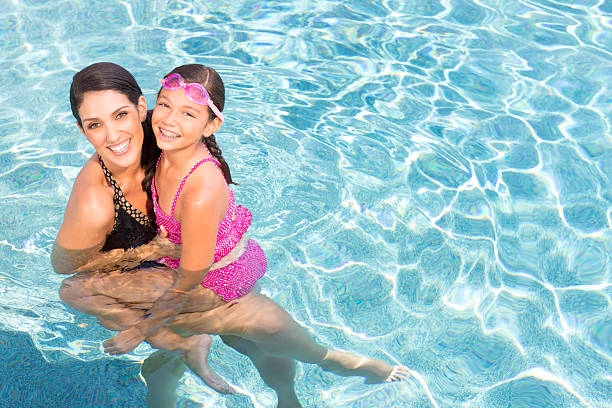 istock Mother and Daughter in Pool 165847294