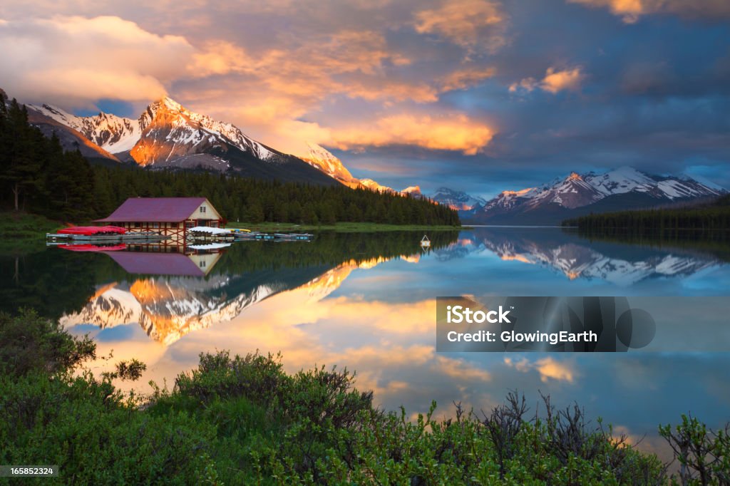 Maligne Lake Fire and Ice Dramatic Rocky Mountain sunset at Maligne Lake in Jasper National Park, Alberta, Canada. Maligne Lake Stock Photo