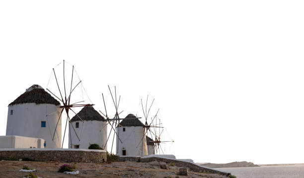 Windmills isolated on white background, Mykonos island, Greece.