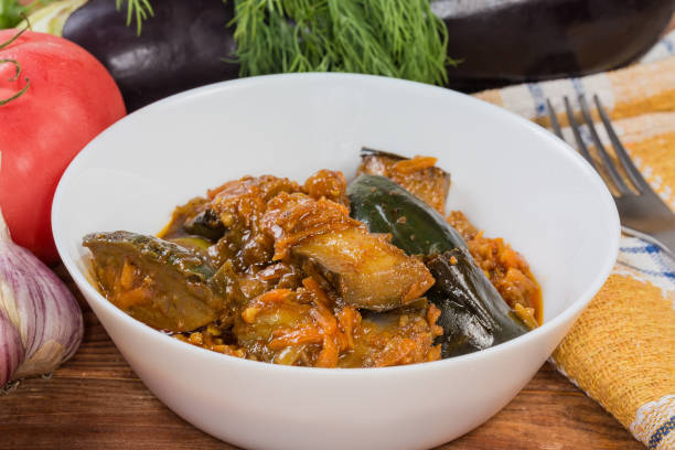 istock Eggplant pieces stewed with other vegetables, side view close-up 1658544459