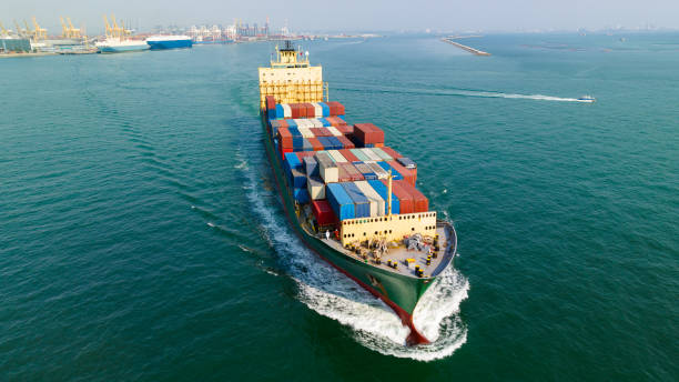 istock cargo logistic container ship sailing in sea to import export goods and distributing products to dealer and consumers worldwide, by container ship Transport, commercial port background, 1658558333
