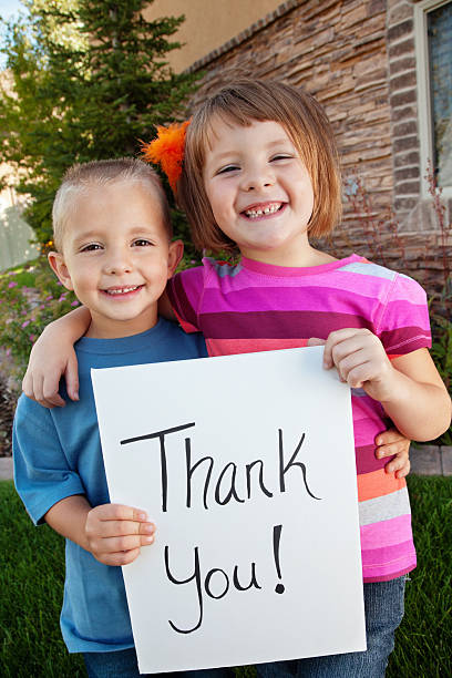 istock Cute siblings holding a Thank You sign 165855896