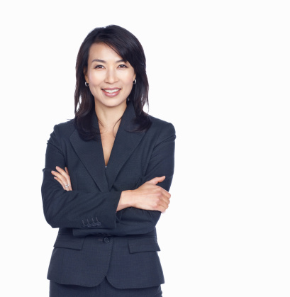 Portrait of beautiful business woman with arms crossed on white background