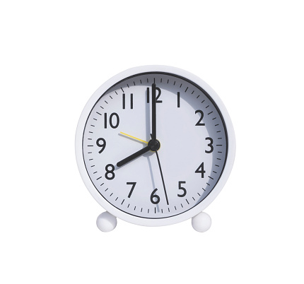 White round alarm clock in 8 o'clock isolated on white background with clipping path