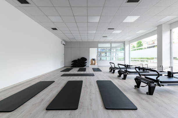 istock Pilates studio gym with mats, reformers and Pilates arcs 1658605313