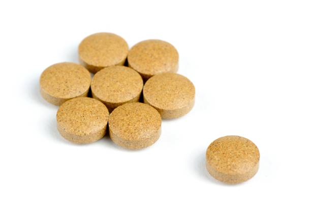 Herbal valerian pills isolated on white background