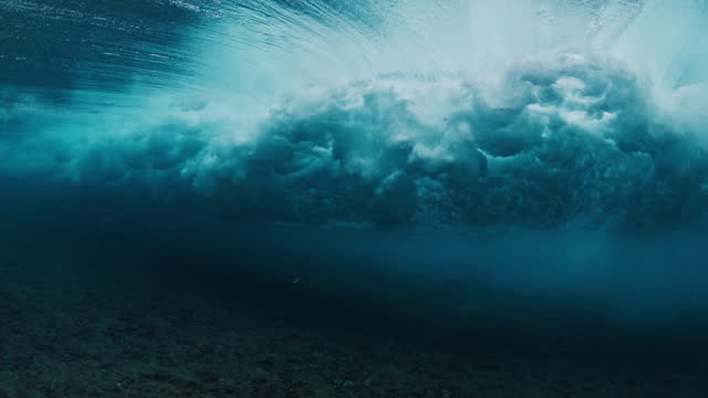 Underwater view of the ocean wave breaking in the Maldives