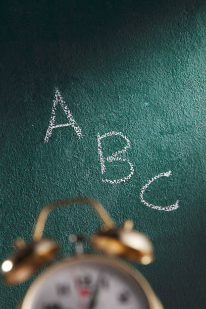 istock alarm clock in front of the chalk board 1658651162