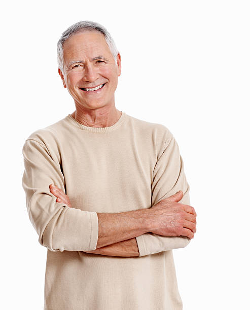 istock Mature man smiling with arms crossed 165866149
