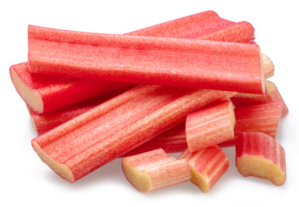 istock Red rhubarb stems' cuts isolated on white background. 1658662521