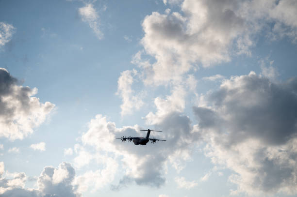 istock Cargo plane in moody cloudy sky 1658677423