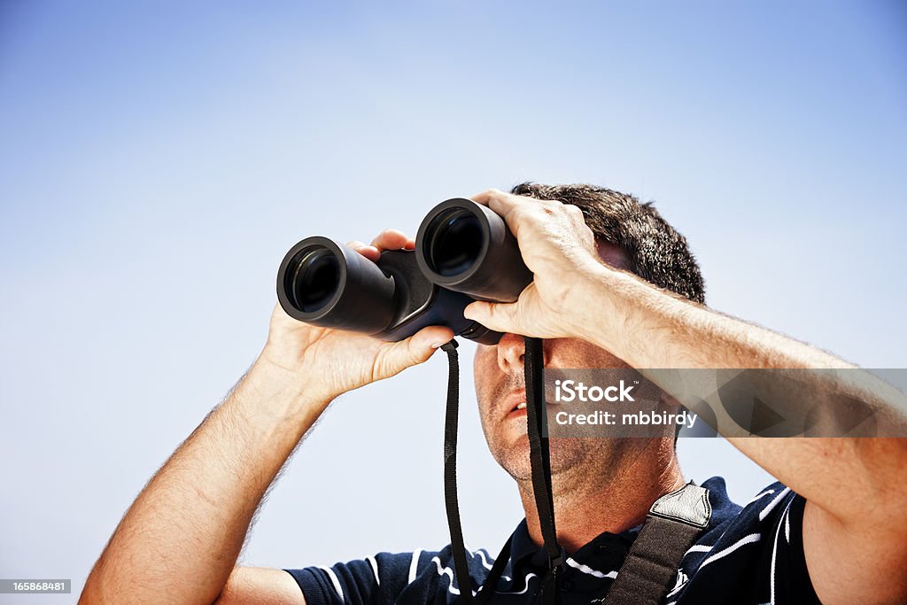 Sailor with binoculars on sailboat Sailor with binoculars on sailboat. 30-39 Years Stock Photo
