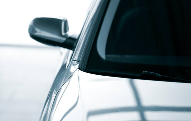 Modern parking car blue toned image with shallow depth of field windshield stock pictures, royalty-free photos & images