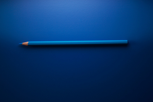 blue color pencil on the blue background