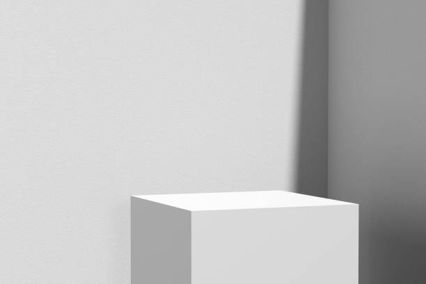 Gray colored podium and wall with summer sunlight. Stand or background for product display. Gray colored podium and wall with summer sunlight. Stand or background for product display. Mock up empty pedestal for presentation.3D render. stock cubes stock pictures, royalty-free photos & images