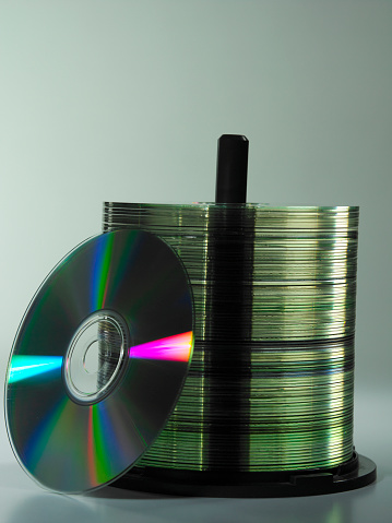 stack of the cd on the plain background