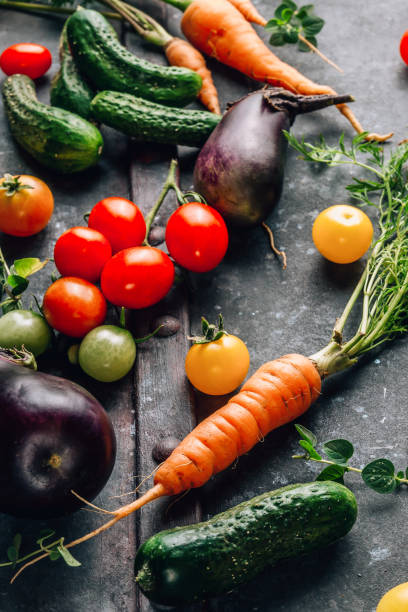 istock Petite Veggie Bounty. Mini-vegetables, fresh carrots, cherry tomatoes, tiny cucumbers, eggplants 1658733805