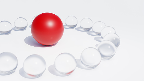 Leadership, solution concept. Abstract red sphere in the middle of circle of other smaller glass spheres, isolated on white background