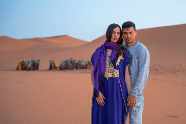 istock Couple hugging each other in the desert 1658739591
