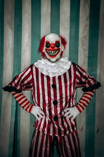 istock evil redhead clown stands in front of the tent 1658755066