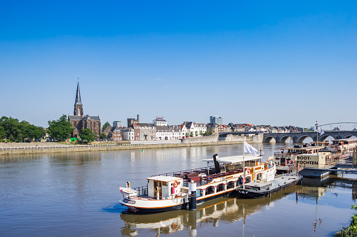 Cruiseship on the river Maas in historic city Maastricht, Netherlands