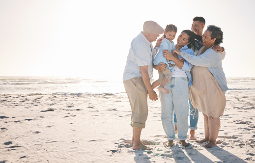 Family, mockup and a girl on the beach with her grandparents in summer for holiday or vacation together. Love, sunset or flare with parents, children and old people by the ocean on banner space