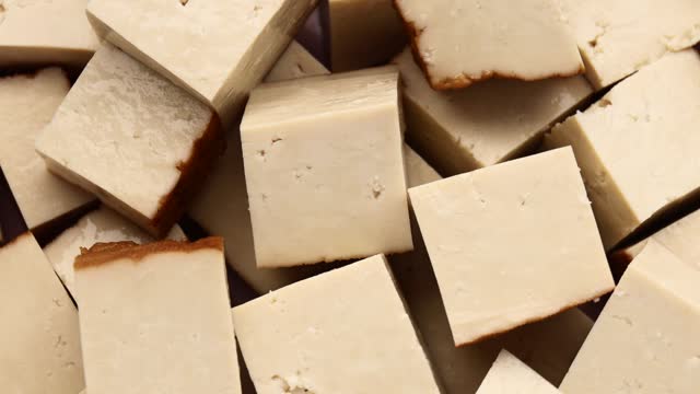 chao tofu cubes, rotation in circle. Raw organic vegetarian food