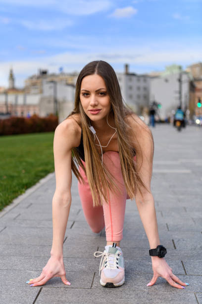 istock A Young Woman is Preparing for Work Out and Stretching Legs. 1658800657