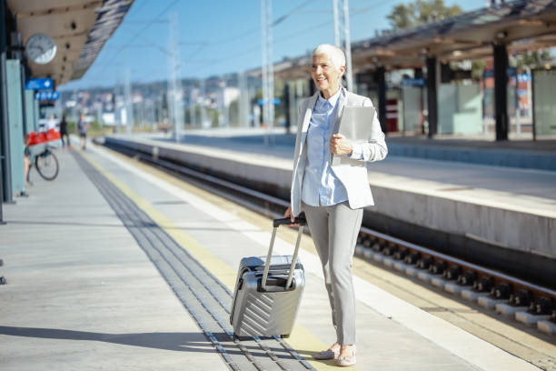 istock Female senior commuter at the train station 1658803805