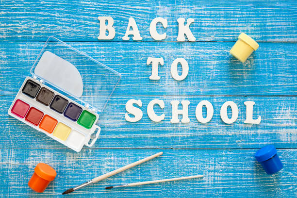 istock Back to school concept on wooden blue background, top view. 1658804382
