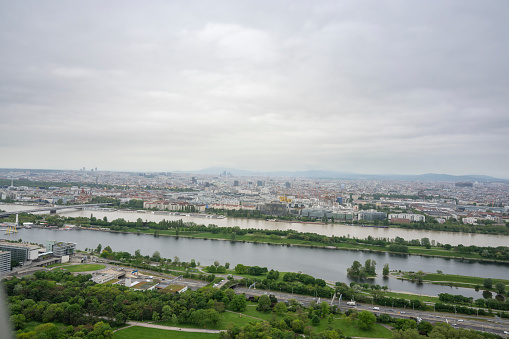 Panoramic view on Vienna at the Danube river in Austria during an overcast day.