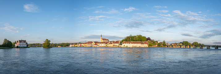 Inn river at the town of Schärding in Austria during a springtime sunset. The river Inn is the largest river flowing into the Danube (Donau), the longest river of Europe.