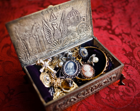Silver, antique European jewelry box, with golden rings, earrings, necklaces, with engravings in Greek.