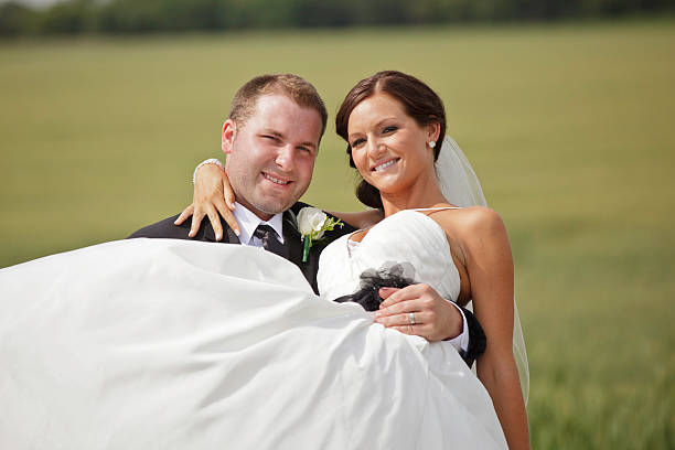 istock Wedding Couple Groom Carrying Bride 165883788